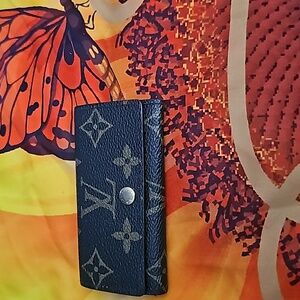 Louis Vuitton Logo Print Key Holder. Great Condition